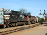 5 o'clock rolled around quite quickly today and as I left the office I found out that CN train 360 was approaching Brantford with Canadian National and Norfolk Southern power.  I pulled into the station about two minutes before the train came into sight with CN 2263, NS 9705 and NS 9359, CN 2691 as the DPU's.  Pictured are the DPU's on today's 360 providing a bit of a smoke show as they hammer passed me.