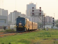 A eastbound VIA passes under the signals after departing the London VIA station.