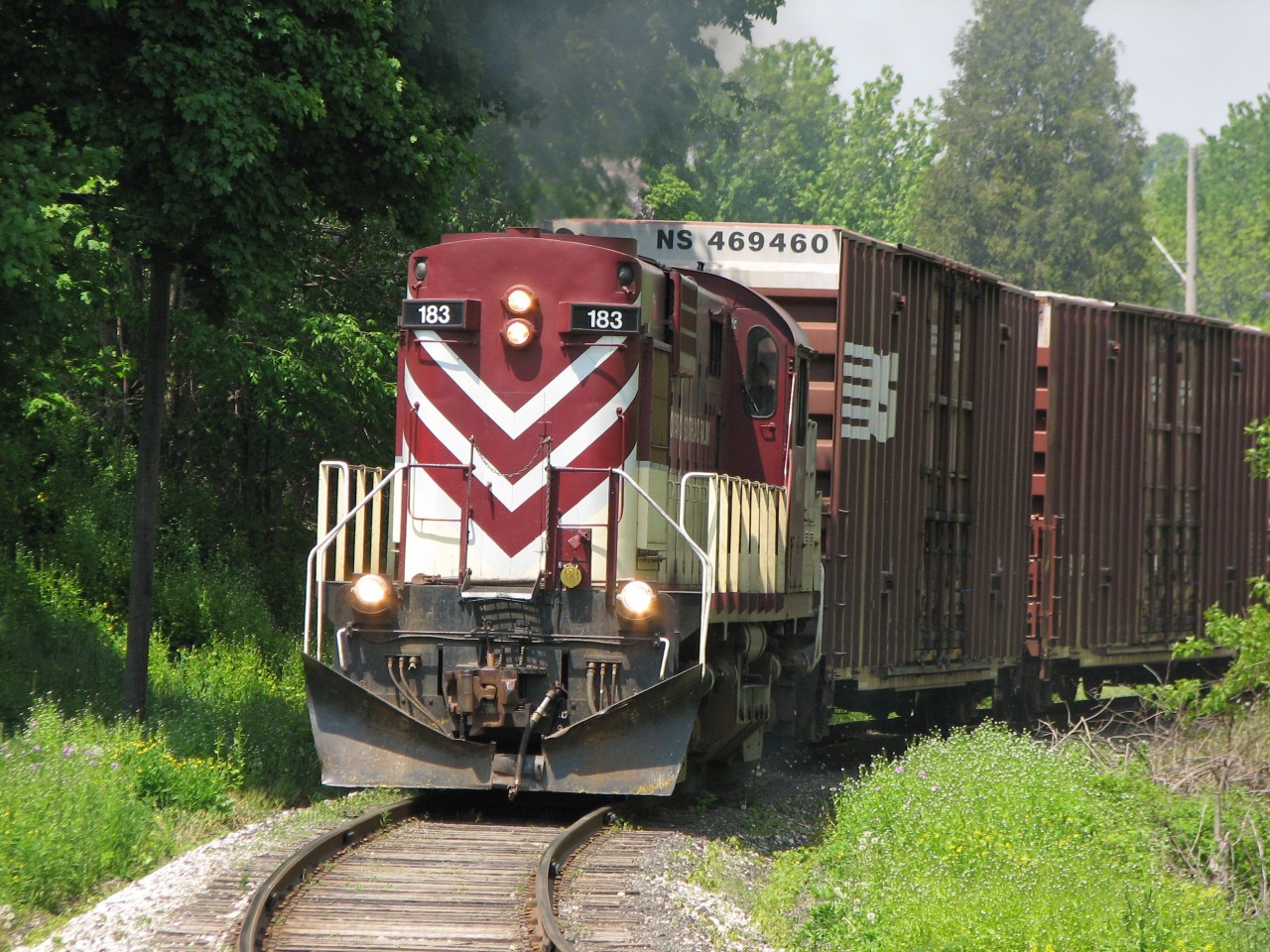 After picking up a few cars left in Ingersoll by CP, Ontario Southland 183 begins the trek to Tillsonburg.