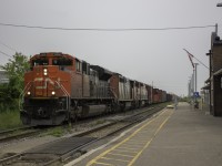 Although a daytime appearance of CN 421 is now rare in St. Catharines, this is the second day in a row its done so. CN 8902 leads a pair of GE cowls past St. Catharines just before rain set in.