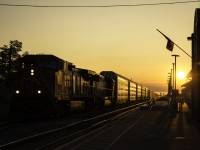 Rarely am I ever happy with the lighting that is displayed around any train that passes through Niagara, however I can't complain about this. With evenings shortening everyday, and a CN 330 that shows up well later than usual, the sun ended up just above the roof of the station as it passed by with CN 2597 and IC "Deathstar" 1036. Looking a little more like CN 421, this train had autoracks and autoparts cars, the autoparts of which are especially a rarity. Nipping at 330's heels was GO 781, which was 14 minutes late. If it had been on time, 330 likely would have held back at Nelles Road, and this decent lighting would have ceased to exist. Then again, I'd just be capturing a GO train with the sun in the background, however I take the freight. The sun makes the adjacent track look like it was part of a branch line, but indeed this particularly section is good for 60mph for freight, 65mph for passenger.