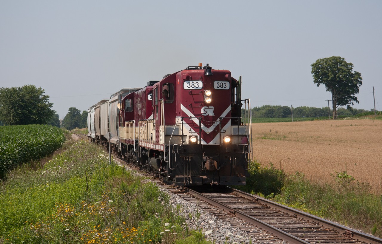 Headed towards Ingersoll after lifting cars at Putnam. They will lift cars at CAMI then go to Woodstock. Passing my family home @ Mile 11.