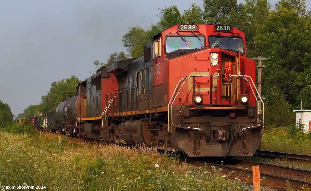 Just as CN 308 flies by braking the silence of the peaceful countryside, before the gates could go back up to their fully up position they go back down as CN 369 is quickly approaching. A GE DASH 9-44CW and a GE DASH 8-40CM should be enough power for this short train, as it quickly heads towards Toronto.