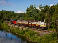 <b>Canada's Finest</b>. Ever since I was a child I have always been spellbound by the elegance of Canadian Pacific's small but notable fleet of F Units. Since I first saw photographs of the Royal Canadian Pacific in Greg McDonnell's 'Stand Fast Craigellachie' many years ago, I have always wanted to photograph these units for myself. Finally, after years of waiting I was given my chance to photograph this remarkable set of locomotives. In a pastoral scene not too far away from the hustle and bustle of Toronto's many suburbs, train 40B rushes towards London with a photogenic lash-up and notable passengers on board. Upon receiving news that this train was coming through, I didn't hesitate to go through a little extra effort to get the shot I wanted. In this case, it was clinging from the top of a tree. What we do for trains.