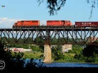 Flying high - both a Canada Goose and a pair of old soldiers on a CP Work train are high above the Grand River at Galt Ontario - the OCS move heading back to Toronto after a days work on the Galt sub. The train is framed in the scenery at Riverside Park - bridge is shootable from the north side during the summer months from about 6:30PM to sunset during the long summer days only.