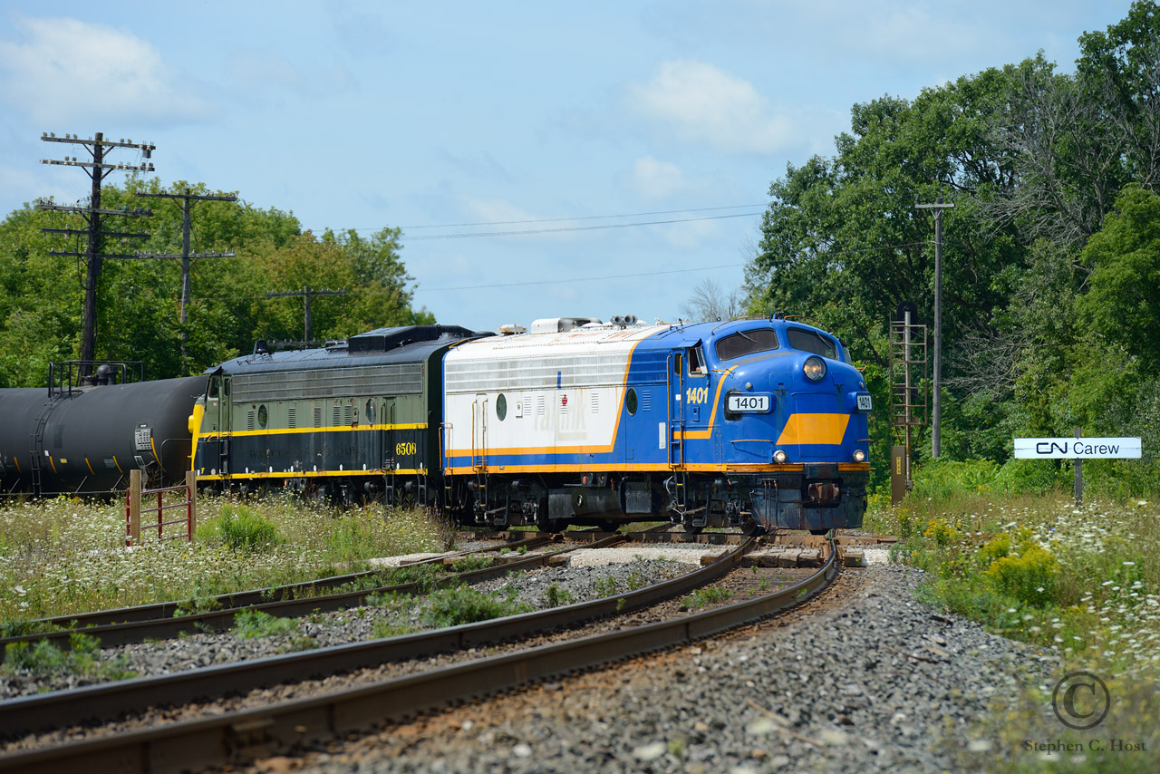 What a treat - a pair of covered wagons hauling freight trains in North America again. In this scene at Woodstock, the pair of FPA's cross the CN Dundas Subdivsion at Carew Diamond to yard their train of about 25 cars and go for lunch. Trailing 1401 is OSRX 6508,ex WSJR 6508 (Tourist train at Waterloo 1998-2000) ex CN 6508