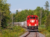 The chase has begun, trundling through Manvers, a trio of GP20's have this short 20 car train in hand. With recent and on going track work and ballast dumping along various spots, the push is made to get the line back up to 30 MPH instead of 10 MPH TSO which currently stands for the entire line.