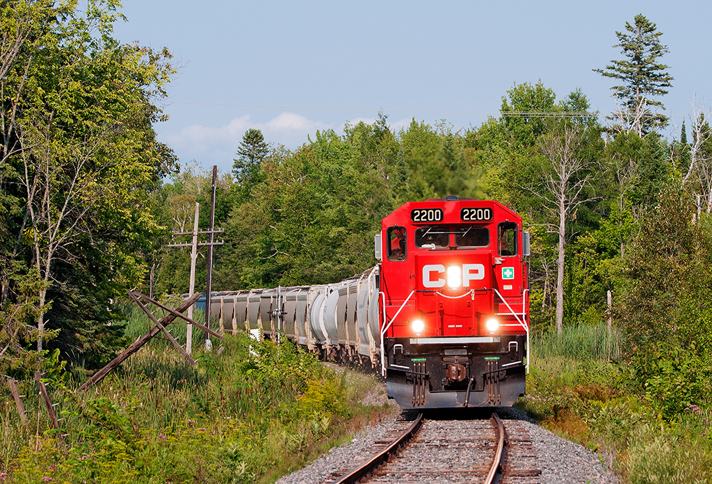 The chase has begun, trundling through Manvers, a trio of GP20's have this short 20 car train in hand. With recent and on going track work and ballast dumping along various spots, the push is made to get the line back up to 30 MPH instead of 10 MPH TSO which currently stands for the entire line.