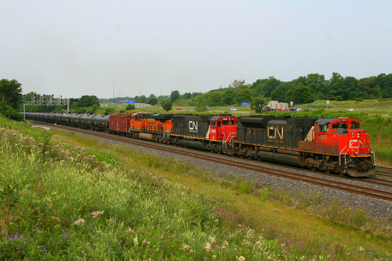 After being held at Snake to allow VIA 80 to sccot by, CN 8880, IC 1008 and BNSF 6977 get 710 rolling again.