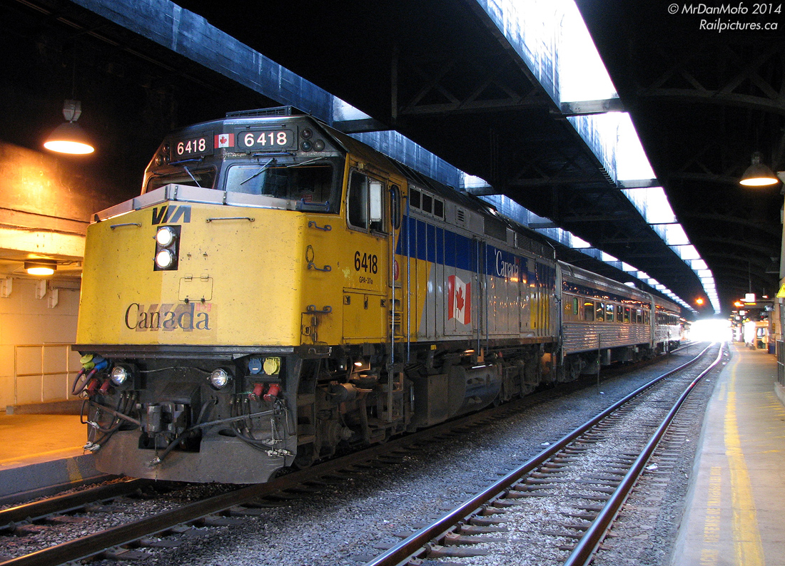 VIA trains using Track 1 isn't a frequent occurrence as it's usually GO-only - VIA uses the higher numbered platforms at the south end of the train shed. Today however that's not a Georgetown GO train, but VIA #93 for Niagara Falls loading on Track 1 under the train shed at Toronto Union Station. F40PH-2D 6418 leads the two stainless steel Budd "HEP" cars, awaiting departure in just over an hour at 11:00am.  Fast forward a few years, and the majority of the Niagara Falls VIA trains were cancelled in 2012 when GO started running their own trains to the 'falls.