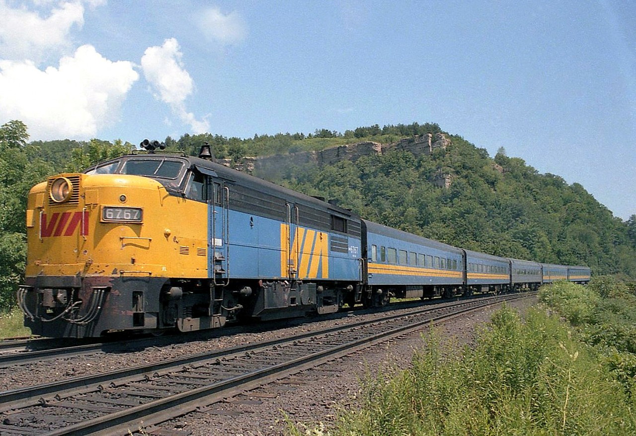 VIA train 83 climbs the Dundas escarpment at Dundas, 30 years ago in August 1984. MLW-built FPA4 6767 leads a nearly perfect consist (with an ex-CP Budd car mingling among the matching ex-CN blue and yellow equipment).