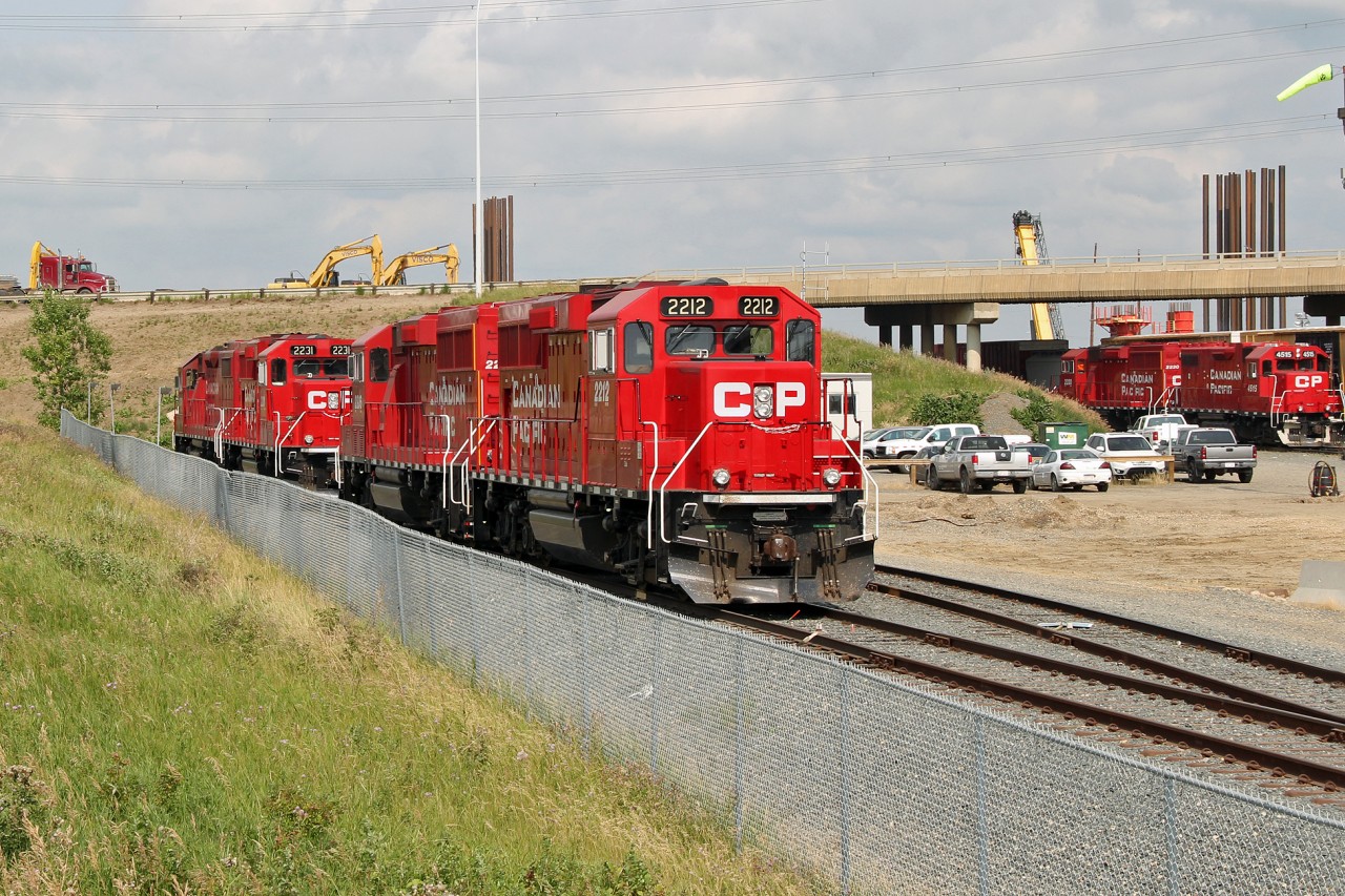The GP20C-ECO is another variant in EMD's repower catalog originally launched in 2008.  CP used GP7u's and GP9u's for these rebuilds.  As a cost saving measure they are built to Tier 0+ standards.
In this shot at CP's clover Bar Yard in East Edmonton CP 2212 and 2236 have just been parked at the end of their shift.  Behind them is another ECO unit # 2231.  In the far right background of the picture, still at work are Ex SOO GP38-2 CP 4515 paired with another ECO unit, #2230.