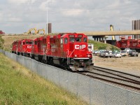 The GP20C-ECO is another variant in EMD's repower catalog originally launched in 2008.  CP used GP7u's and GP9u's for these rebuilds.  As a cost saving measure they are built to Tier 0+ standards.
In this shot at CP's clover Bar Yard in East Edmonton CP 2212 and 2236 have just been parked at the end of their shift.  Behind them is another ECO unit # 2231.  In the far right background of the picture, still at work are Ex SOO GP38-2 CP 4515 paired with another ECO unit, #2230.
