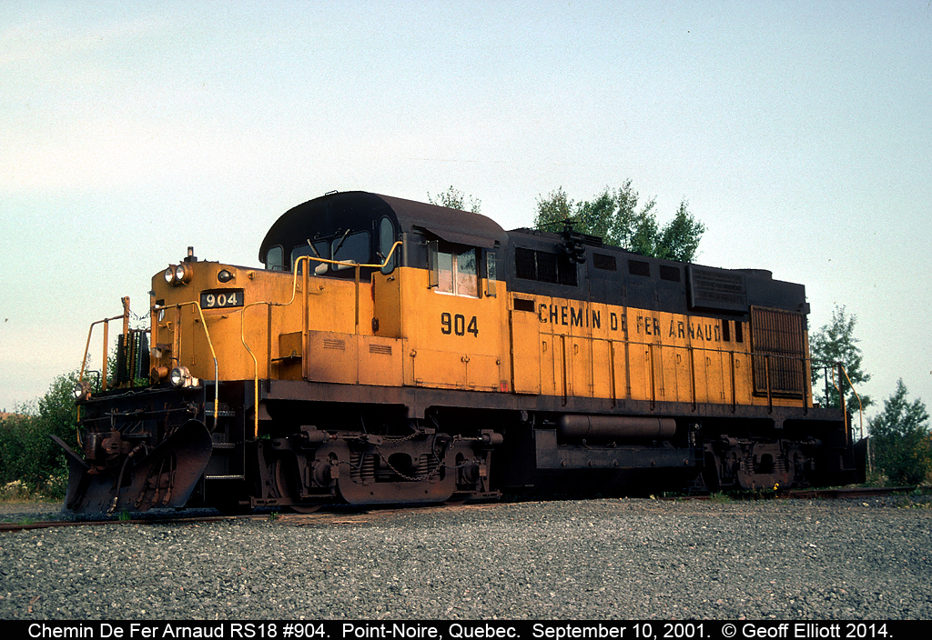 Chemin de fer Arnaud RS18 #904 rests from it's assigned duties on an MOW train just outside Point-Noire, Quebec.  At this time the QNS&L was moving the trains for Cliffs Mining on both the Wabush Railway and the Arnaud.  Since then Cliffs has leased CEFX AC44's to move the ore from Wabush Lakes, Labrador to Point-Noire, Quebec.
