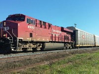 After stopping and uncoupling from his train to inspect the yard for work, CP 8952 has recoupled to his train and, with a friendly wave from the conductor, is accelerating eastward. Thanks dad for bringing me out. 