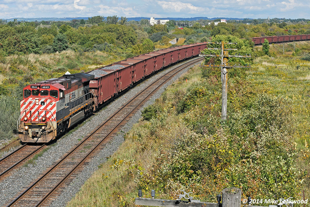 With Herzog on the headend and (unseen) multilevels on the tail, BCOL 4643 curves onto the 'new' Kingston Sub alignment at Bowmanville. New is a relative term, as in this case it refers to sometime around 1912! Between the east side of Oshawa and Port Hope there were a number of minor and at least two major relocations, this one (Darlington to Bowmanville) and the other from Newtonville to Port Hope. 1454hrs.