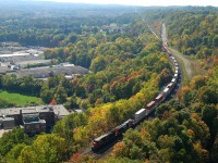 A pair of ex-Union Pacific C40-8's (2127 and 2035) bring 148 down the hill through the small town of Dundas, ON