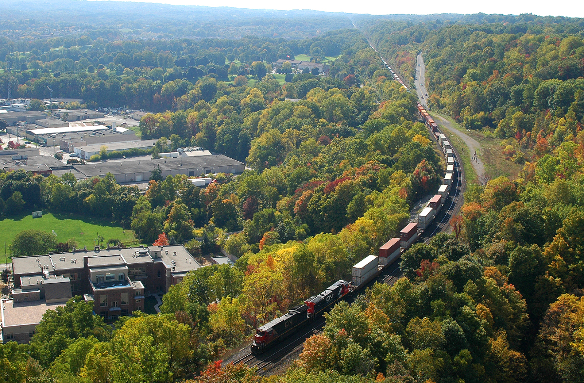 A pair of ex-Union Pacific C40-8's (2127 and 2035) bring 148 down the hill through the small town of Dundas, ON