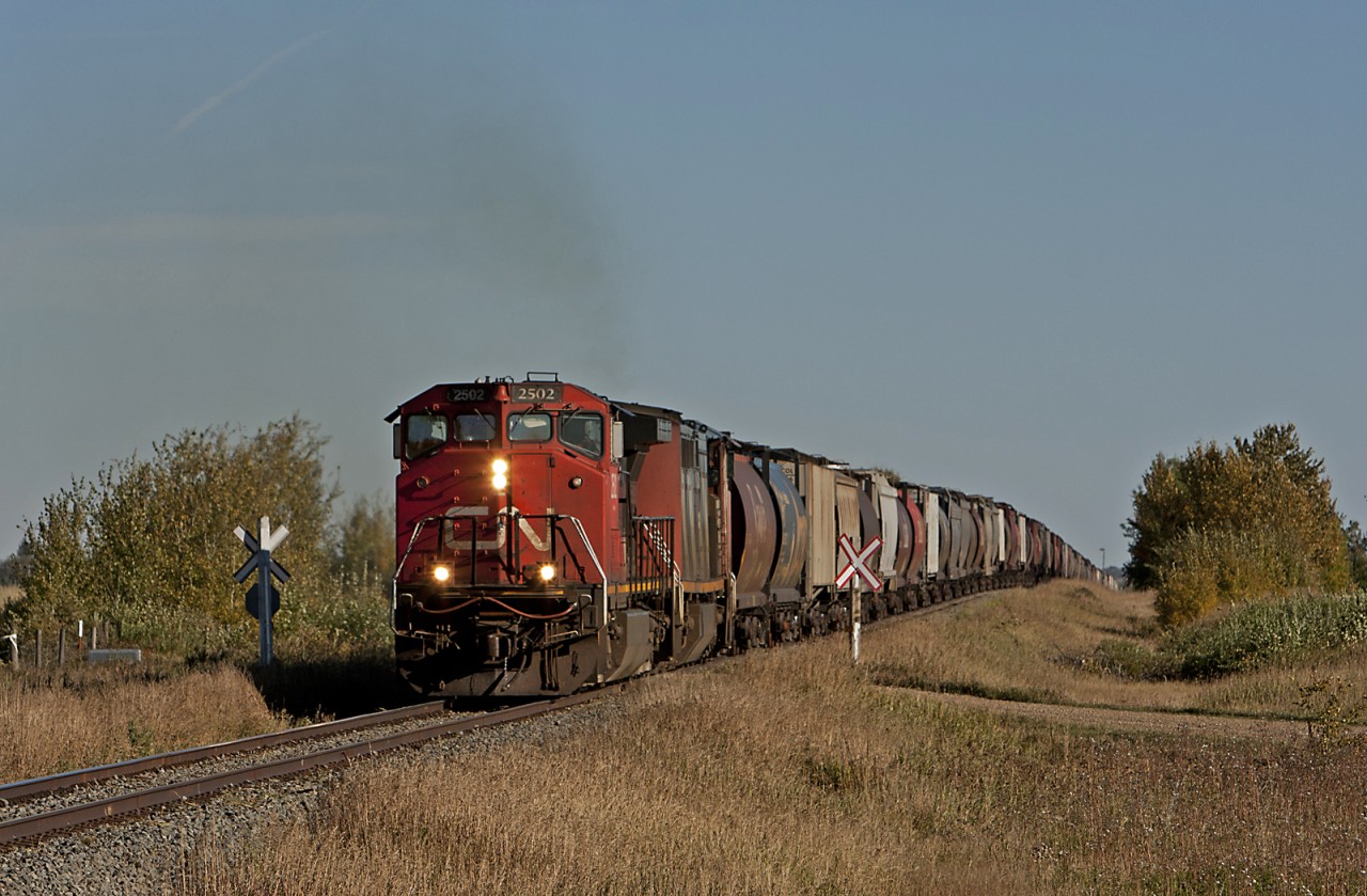 Northbound freight crests a short grade on the Camrose Sub