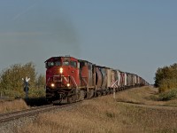 Northbound freight crests a short grade on the Camrose Sub