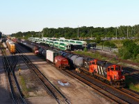 Almost 26 years to the day after Keith's photo of CN 4115, we find the same engine still working hard for CN. Despite losing its' external barrel-type spark arrestors, and gaining some wear-and-tear on the paint job, the engine looks very much the same. Here 551's crew is spotting up the night train to Oakville before starting on 435's setout on the next track over. Pretty impressive to see the engine still working for its' original owner after 55 years!