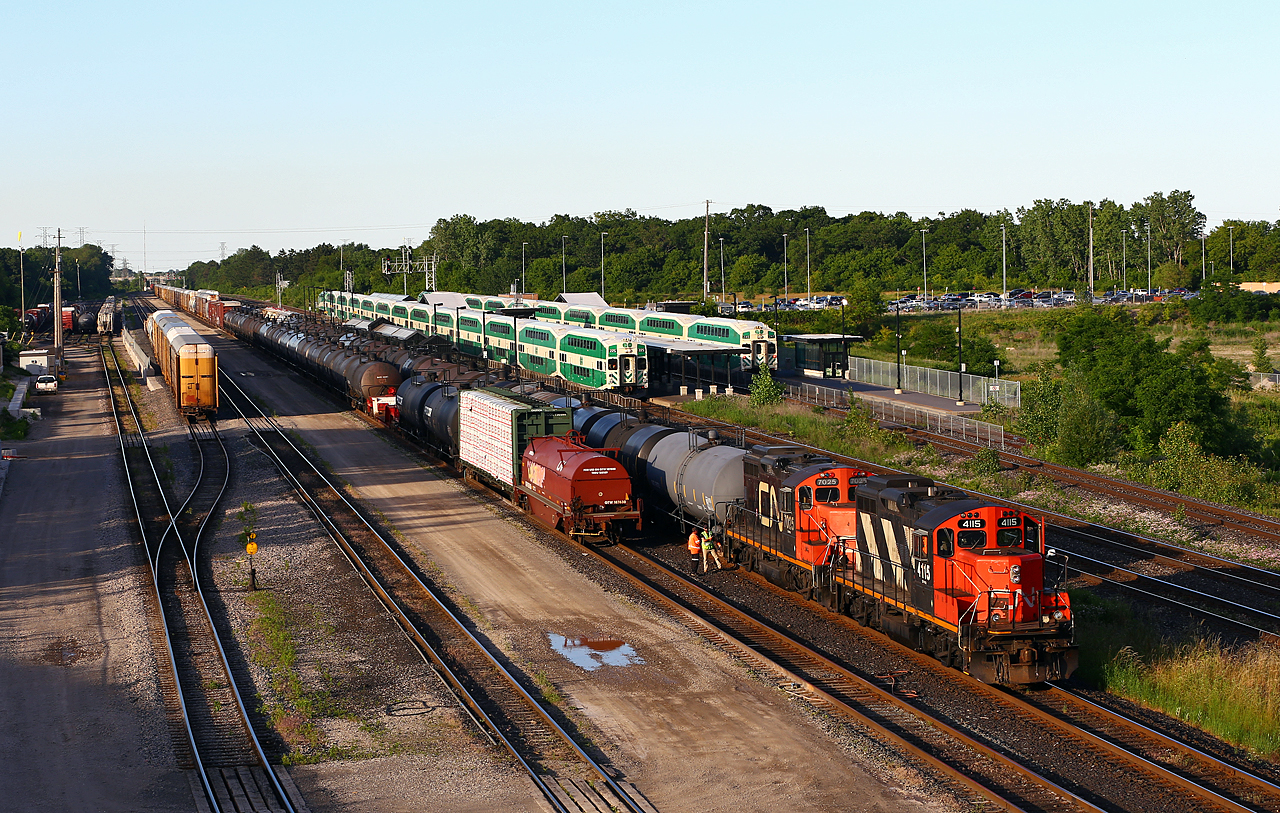 Almost 26 years to the day after Keith's photo of CN 4115, we find the same engine still working hard for CN. Despite losing its' external barrel-type spark arrestors, and gaining some wear-and-tear on the paint job, the engine looks very much the same. Here 551's crew is spotting up the night train to Oakville before starting on 435's setout on the next track over. Pretty impressive to see the engine still working for its' original owner after 55 years!