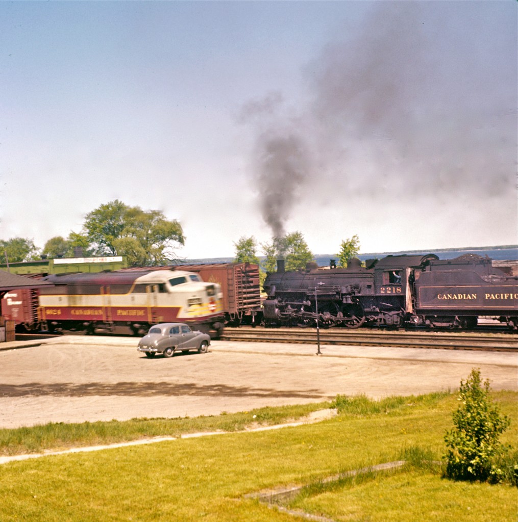 Here we have a great shot of a 1953 Austin A40 Somerset Saloon... oh wait, is this a car picture or a train picture??  Ummm, well, the diesel fans will enjoy the view of CPR 9124... the steam fanatics will enjoy Pacific Type 2218... and the automobile enthusiasts will simply enjoy the Somerset Saloon!  In any event, all three came together in Pembroke, Ontario, at the CPR stone station (long since torn down).  The photographer was the late Del Rosamond.  My thanks, once again, to Steve Host at Railpictures.ca, for allowing me to share with you a link to 75 of Del's recently professionally restored images.  You will find them at...   www.CanadianSteam.Smugmug.com