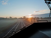 We are eastbound approaching Belleville, Ontario on CN's Kingston Subdivision for a set off and a crew change in the face of a Canadian sunrise.