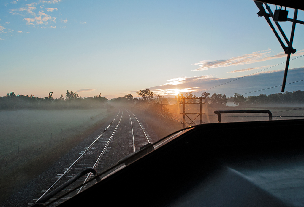 We are eastbound approaching Belleville, Ontario on CN's Kingston Subdivision for a set off and a crew change in the face of a Canadian sunrise.