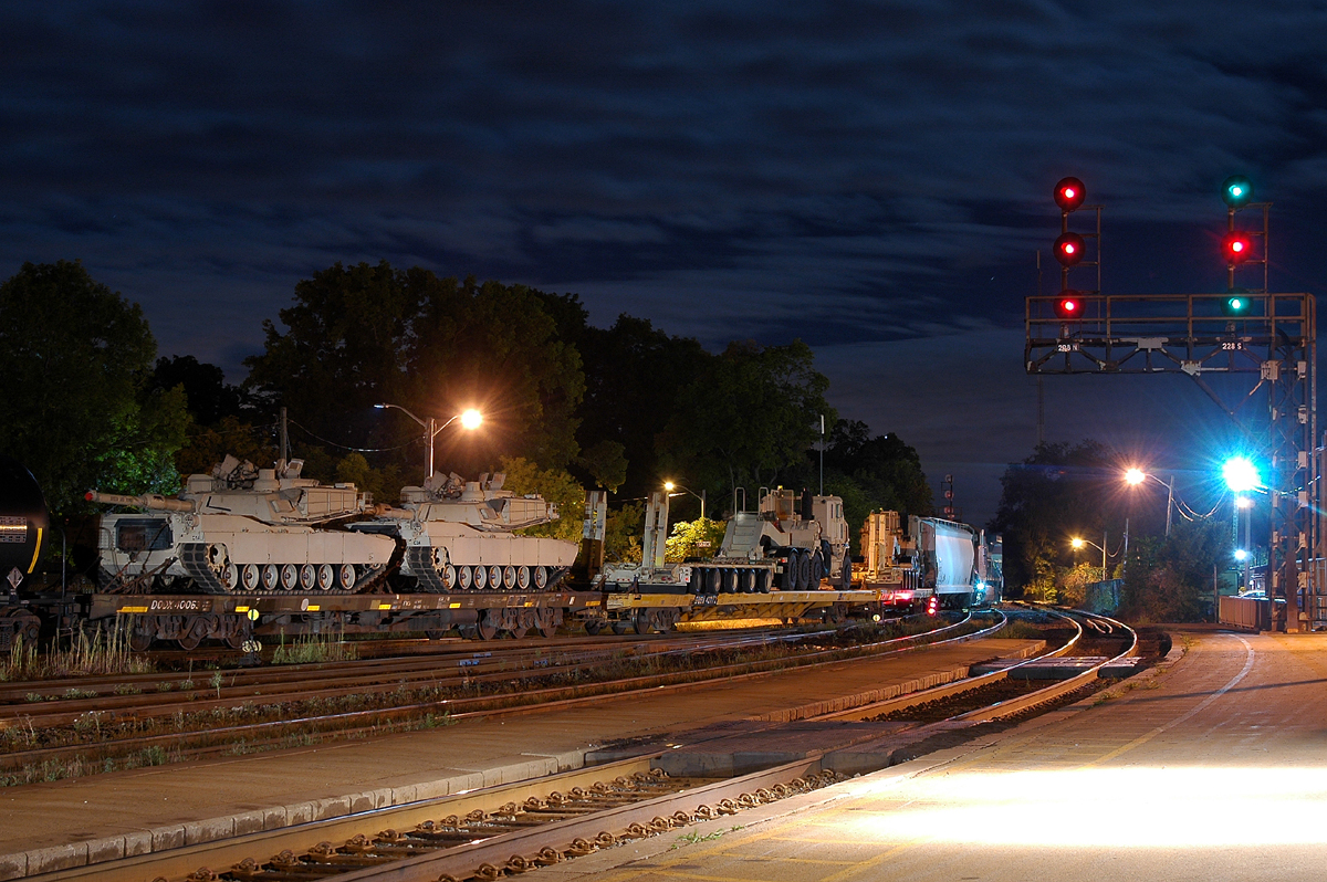 What do we have here ? 394 working Brantford Yard in the early hours of sunday with a pair of US Army M1 Abrams tanks and transport vehicles that are destined for Montreal