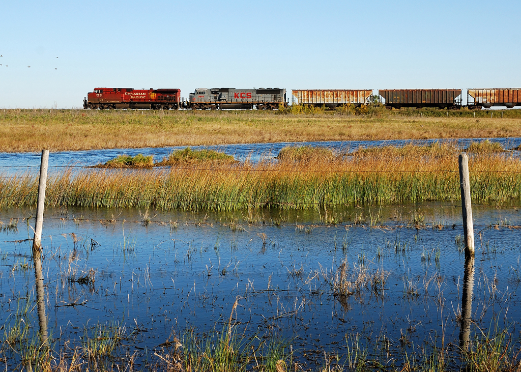 Far from home KCS 3914 helps pull CP 299 along CP's Sutherland Sub towards Saskatoon, SK.