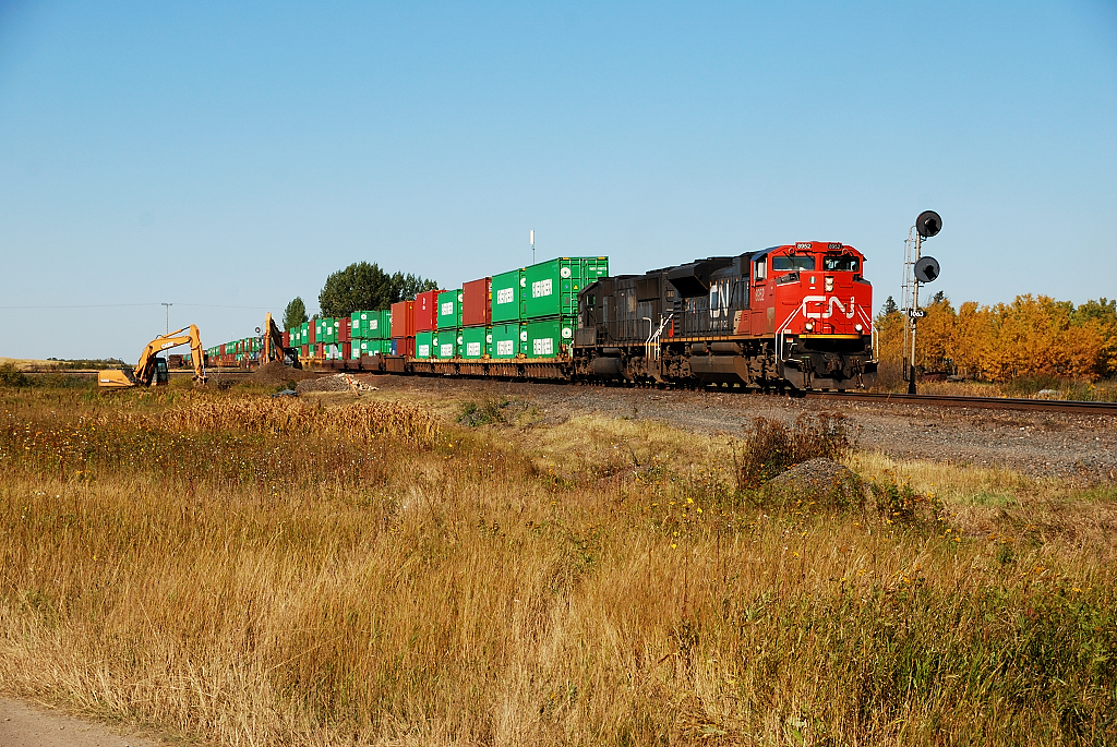 A CN Eastbound hammers over the diamond with CP's Lanigan Sub.
