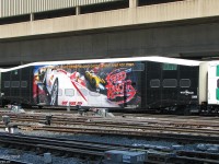 <a href=https://www.youtube.com/watch?v=suCm1w_KTiY><b>Here he comes, here come Speed Racer...GO Speed Racer GOOOOO!</b></a>
<br><br>
Lumbering through the slipswitches of the Union Station Rail Corridor, afternoon GO train 919 heads west out of Toronto, with GO bilevel 2206 wrapped for the then-upcoming Speed Racer (2008) movie. Judging by its 6.1/10 rating on IMDB (typical of many good TV-show to poor movie adaptations IMHO), it probably needed all the advertising it could get...in this case, a whole passenger car's worth.