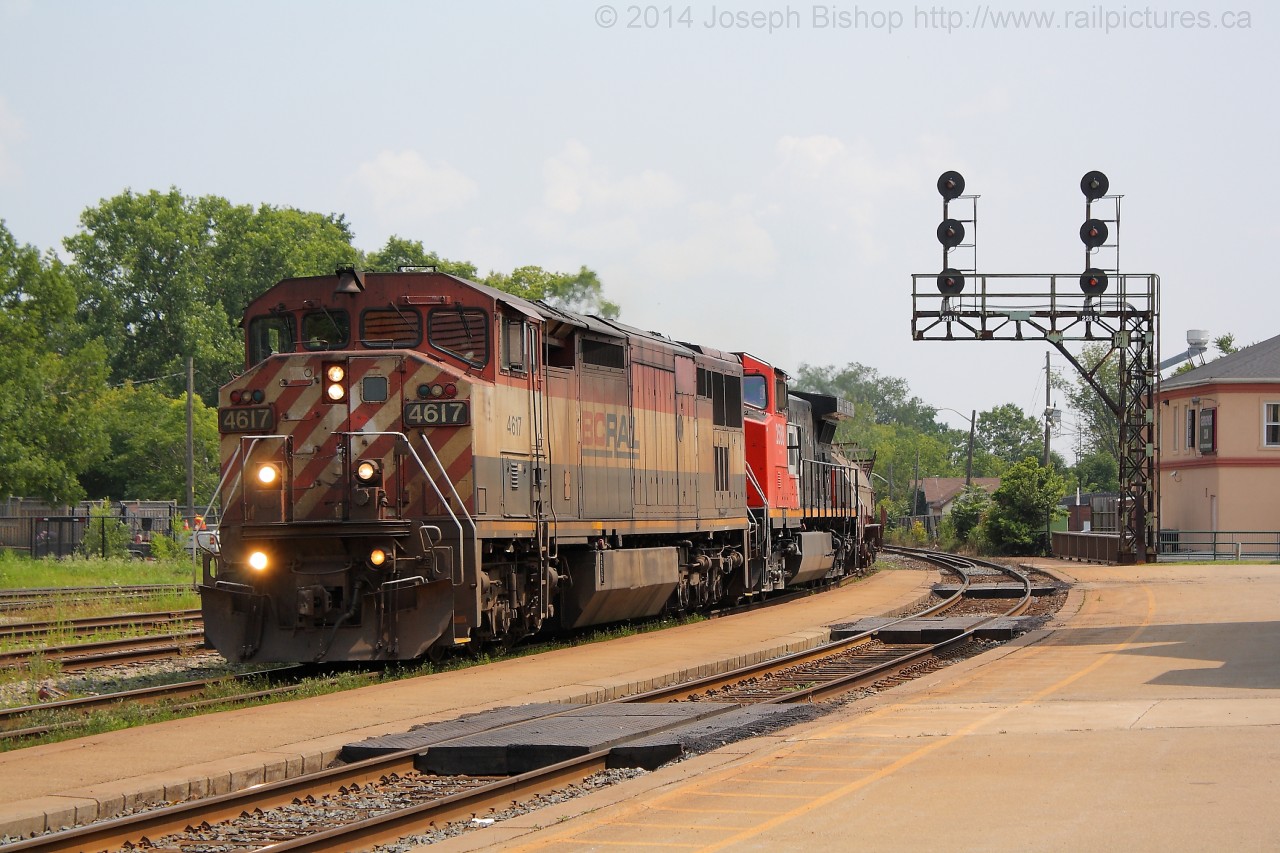 A dirty BCOL 4617 slowly leads 331 by Brantford.  They were hot on the tail of 385 so they were going quite slow by the platform due to having poor signals.