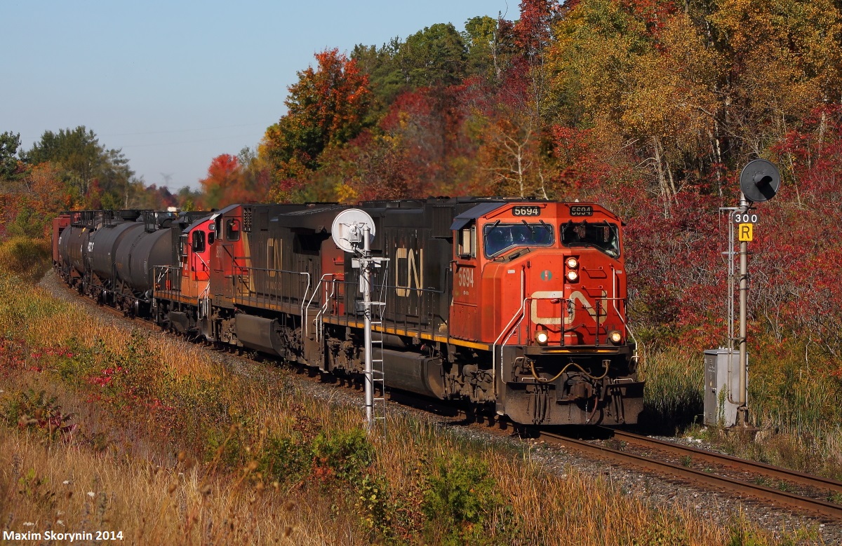 As mid day rolls around, CN A43531 wastes no time breaking the silence in the peaceful countryside. A Geep is also in the trail, which likely got set off at Aldershot yard.
