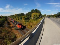 CN M37631 quickly rolls down the grade with GE ES44DC #2223 on point. I decided to try out my Bower 8mm fish eye lens for this one. 