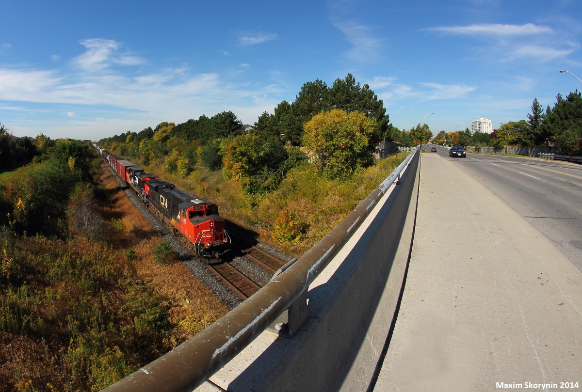 CN M37631 quickly rolls down the grade with GE ES44DC #2223 on point. I decided to try out my Bower 8mm fish eye lens for this one.