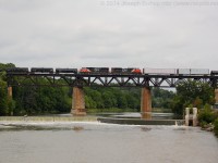 CN train 360 makes its way across the Grand River in Paris Ontario with CN 5750 and CN 8879 providing the mid train assistance.  On the point was CN 8020 and CN 5603.