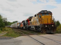 CN 2036 still in its Union Pacific paint leads train 332 by Powerline Road just outside of Brantford on a nice September afternoon.  Trailing 2036 is CN 2246 and NREX 410.  The SW is destined to ArcelorMittal Dofasco in Hamilton.