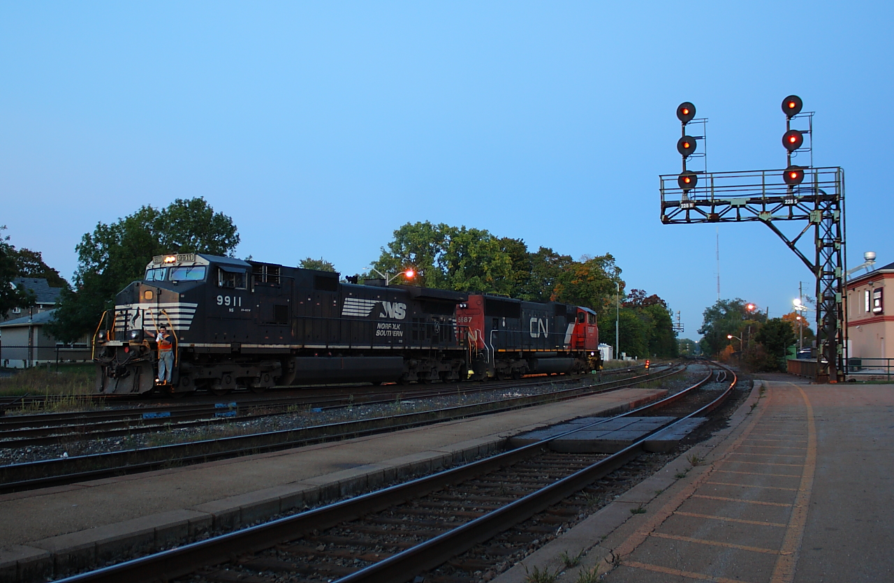 After making their 33 car set off, CN 332's power pauses in the yard at Brantford while the conductor throws a switch to allow them to make a 3 car pick up.  CN 5687 and NS 9911 where the power for 332.