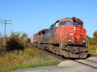 CN 435 blasts by Powerline Road West just outside of Brantford with CN 2519 on the point.  They will soon arrive in Brantford to complete their set off and pick up.