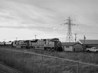 After making my weekly return trip down from Barrie, I noticed CN 330 passing through Stoney Creek. While I wasn't all too happy it was just a pair of CN locomotives, an SD70M-2 leader is something I'll stop for. Trying something different for once, here it is with CN 8824, 2669 and a short manifest passing through Beamsville. In front of the CN shack is a foreman ready to eye for any defects with the train. In less than five miles, a more technologically advanced scan will be done by a hotbox detector. This location holds many memories for me, as I used to railfan here frequently in my puny days, except I always stayed where the CN shack was. However, since then, security has heightened significantly, and my age is high enough now to receive a good scowl from any CN employee bitter towards railfans.