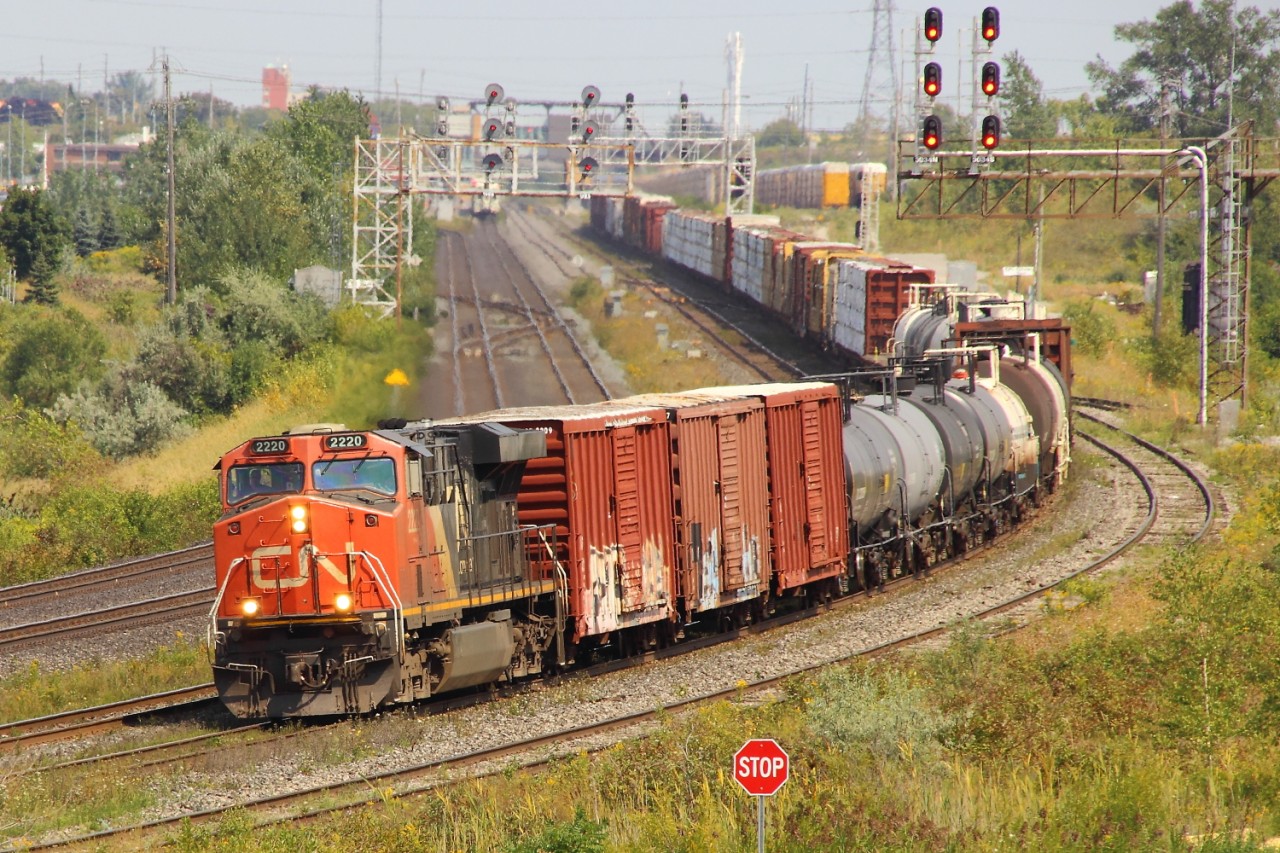 CN 2220 leads a west bound CN train westbound through Whitby, Ontario