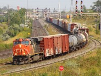 CN 2220 leads a west bound CN train westbound through Whitby, Ontario
