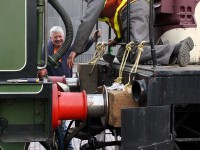 <b><i>British Steam meets Canadian Handyman-ship</i></b> <br><br> From a North American perspective, the ol' British buffer-and-chain coupling system seems a bit ancient, but it probably gets the job done just as well. Volunteers at the Toronto Railway Historical Association hook up their 50-ton CLC-Whitcomb switcher to "Vicky", a 1893 London & South Western Railway steam engine numbered 563. A museum piece shipped across the Atlantic Ocean, it is shown on loan from the Shildon Locomotion Museum in England for a local production of The Railway Children at Roundhouse Park in Toronto.<br><br> Used as a switcher (or "shunter" in British terms), the standard North American knuckle coupler and uncoupling levers have been removed off the CLC-W and roped blocks installed to act as buffers for moving Vicky. Once the crew hooks up the coupling link in between, they'll pull the British steamer off of the "tent track", spin it on the turntable, and store it inside the former CPR John Street Roundhouse. A real <a href=https://www.youtube.com/watch?v=c5GnBvpFnzA><b><i>"Red Green" solution</i></b></a>, but when in Canada...