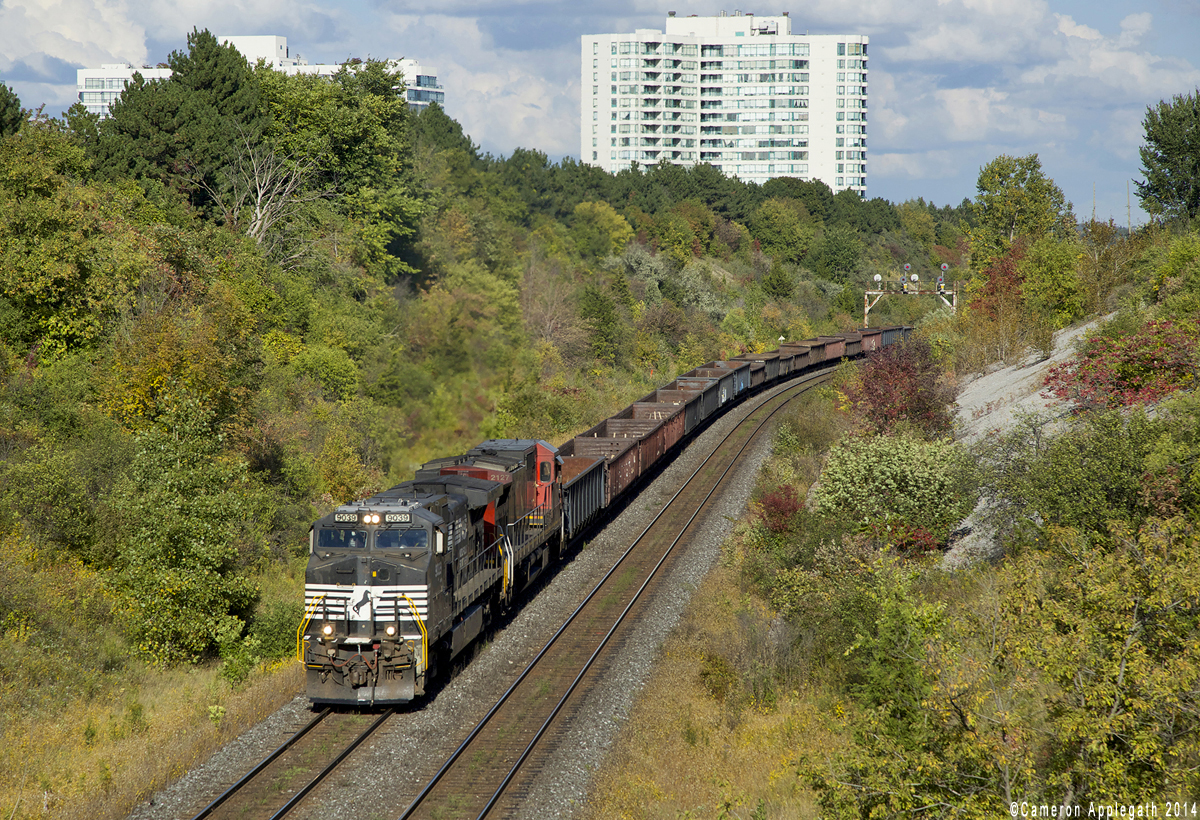 CN X321 trudges up-grade at Hilda ave with NS C40-9W 9039 in charge, of which the crew lamented "Hunk of junk, this is the pride of the fleet!"