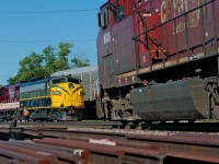 A ratty looking AC4400 meets a pair of vintage looking EMD's at Woodstock, the OSR Woodstock Job awaits a 26 car set off from the CP9525 E before heading back for home.