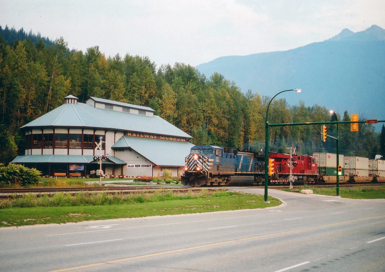 When in Revelstoke, British Columbia, a must for railnuts of all ages is a visit to the Revelstoke Rail Museum, just off the Trans-Canada Hwy 1 at Victoria Rd and Long Av in town. Not only is it close by the entertaining CP yard, it is a fascinating collection of artifacts and documents relating to the building of the CPR that brought Canada together from coast to coast, it is also jam packed with history on CPR and its struggle with the Rocky Mountains. Here is an image of a westbound CEFX 1046, CP 8826 with a long stack train crossing Long Av in front of this most impressive museum structure. Out of sight is a rolling stock display as well. Plan a few hours for a visit in order to "soak it all in".