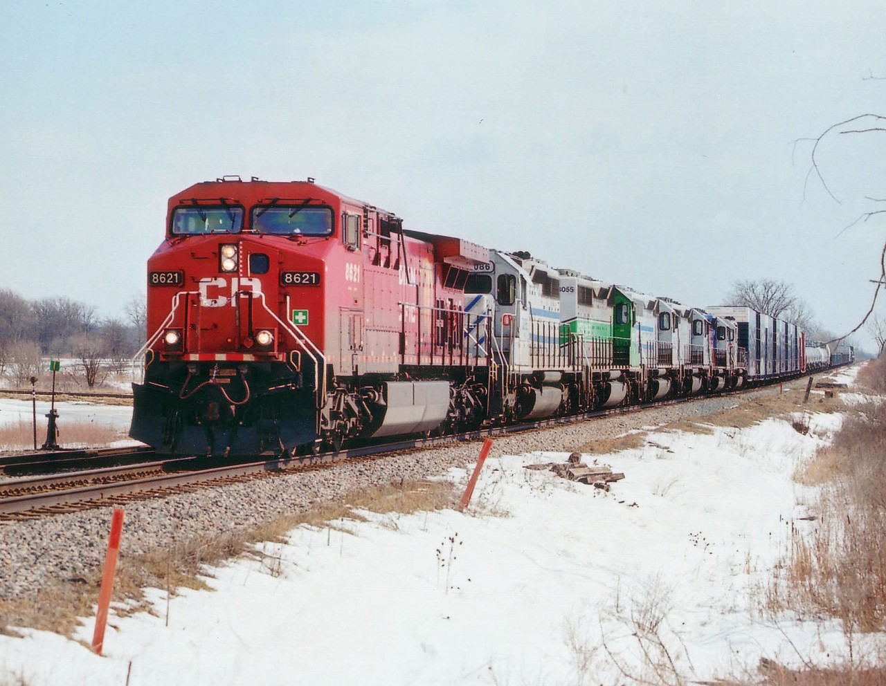 Curse that Niagara Sun!! It always seems to be in the wrong spot. Back/side-lit in this image; as usual, and I got lazy on a cool day and hung out at the plaza in Smithville so I could sit in the car and wait out #247 to see what the power was. Big mistake. Along comes CP 8621, and behind it...GCFX 3086, 3055, 3080, 3073, ALSTOM 3072 and GCFX 3102. What a flock!!!  Unfortunately it is almost impossible to catch trains once they get to speed along the Ham Sub here. The roads go this way, the tracks go that way. So, this shot was it.