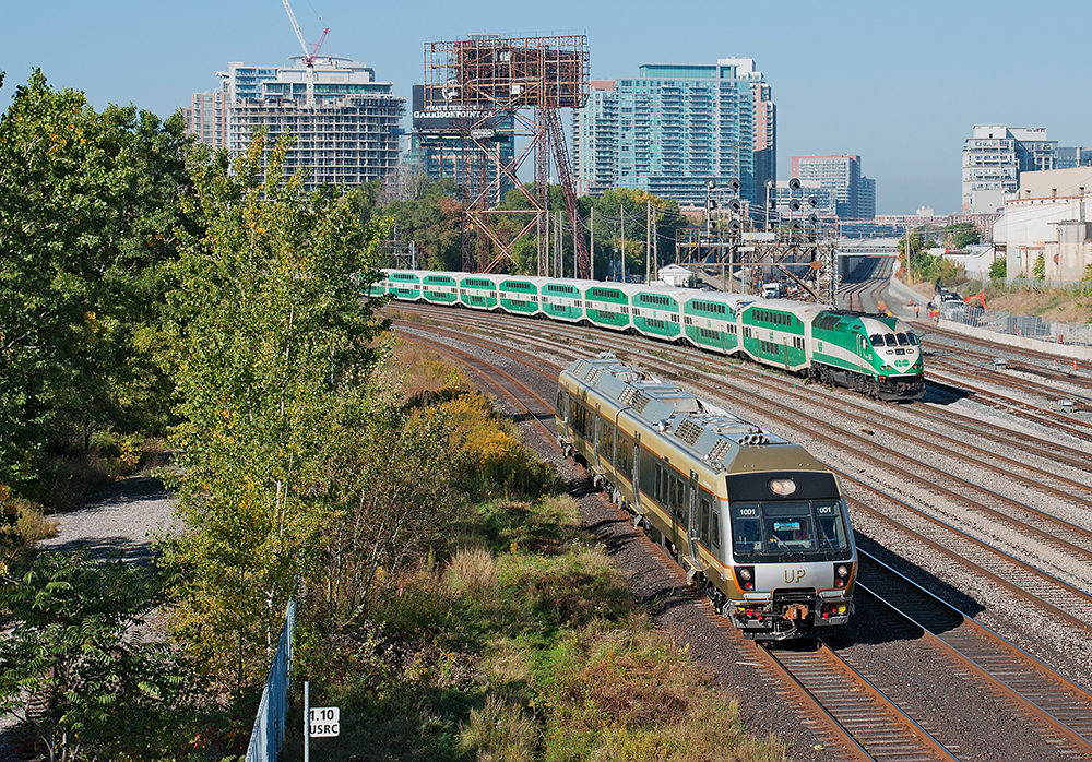 Friday Morning Surprise. UPX 1001 heads eastbound on the Oakville-Kingston south connecting track towards Union Station,  meanwhile a MP40PH-3C shoves a westbound GO train out of the USRC.